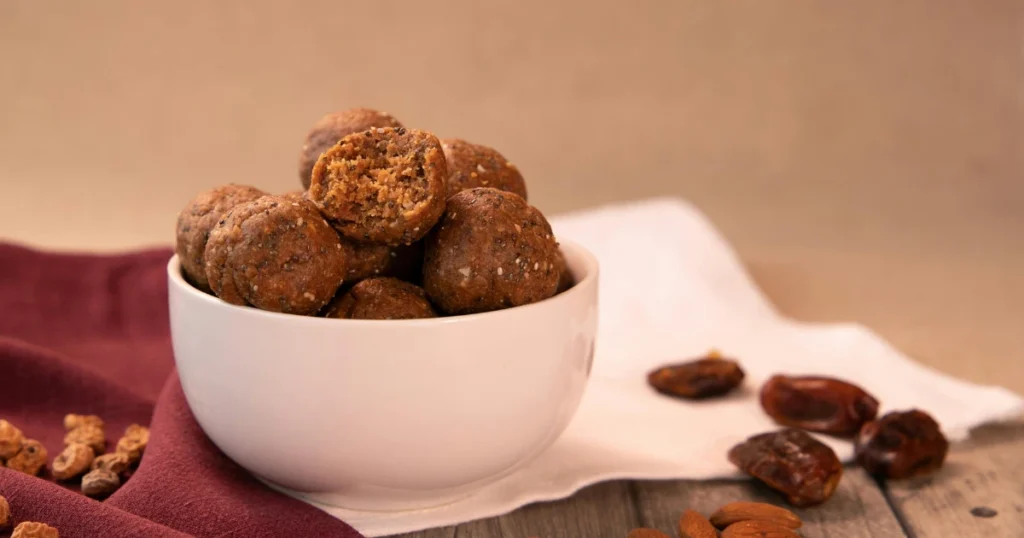 Homemade energy balls packed with protein, nuts, and seeds, perfect high-protein snacks for a quick and healthy option on the go